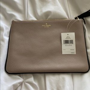 Tan clutch with black trim